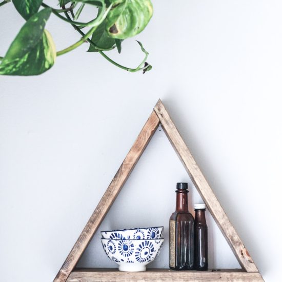 two white-and-blue ceramic bowls on wooden rack