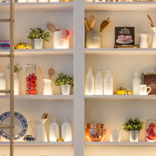 white ceramic bottles on shelf