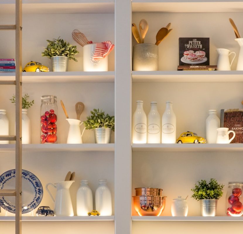 Photo by Jason Leung white ceramic bottles on shelf